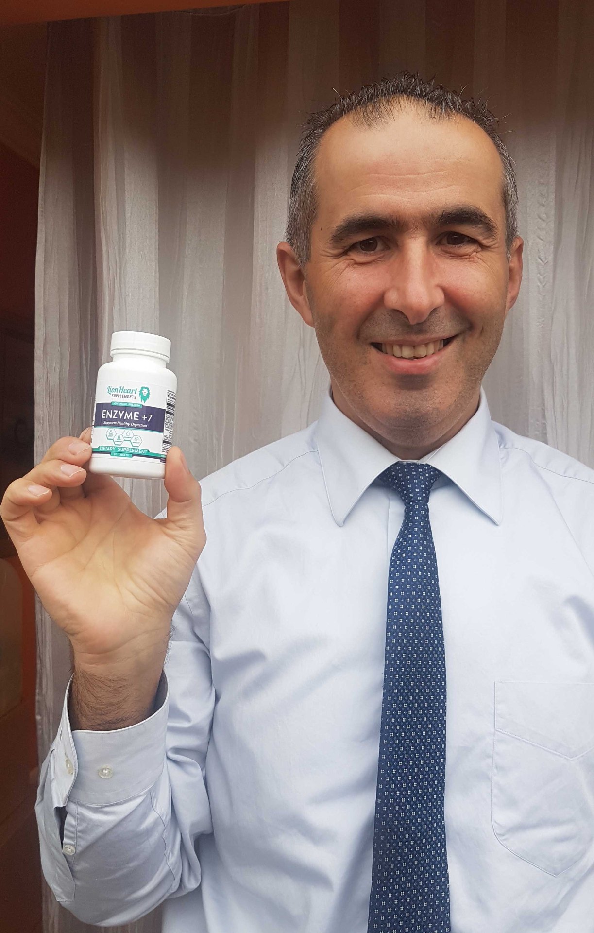 Marco V. holding LionHeart Enzyme + 7
