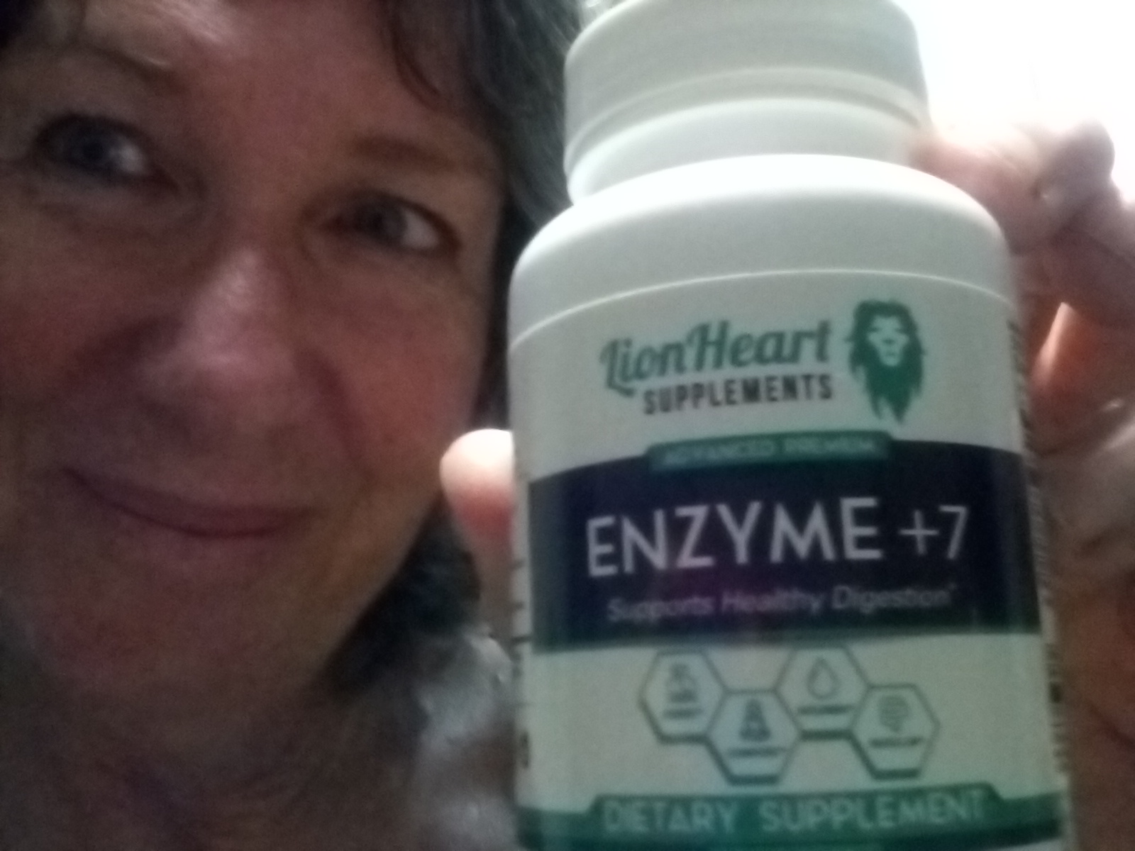 Linda R. holding LionHeart Enzyme + 7