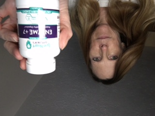 Karen T. holding LionHeart Enzyme + 7